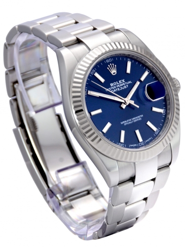 Side view image of a stainless steel Rolex Datejust 126334 with a blue baton dial and a white gold fluted bezel