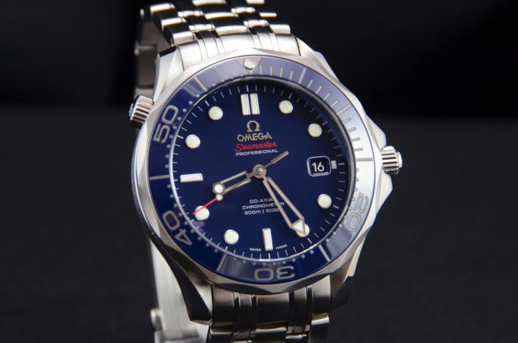 Detailed view of Omega Seamaster 212.30.41.20.03.001 300M diver's watch, with a navy blue dial and ceramic bezel
