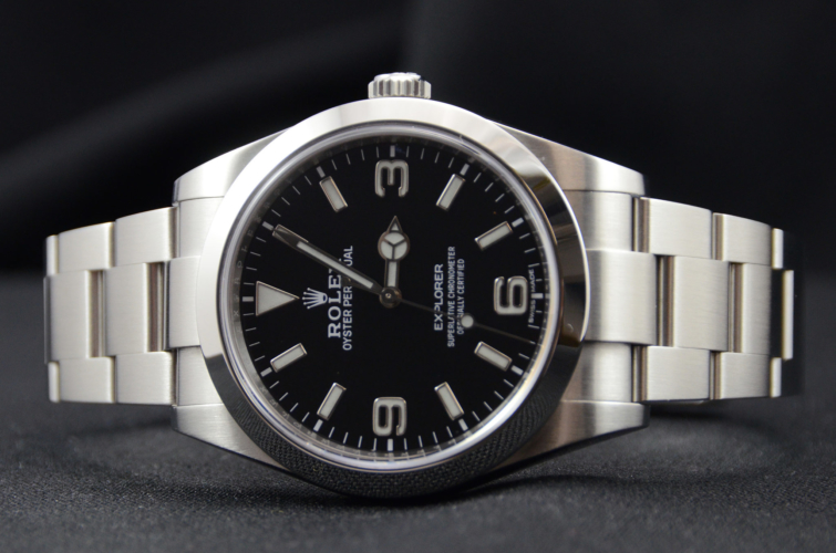 Detailed image of a stainless steel 39mm Rolex Explorer I 214270 with a stainless steel Rolex Oyster bracelet and a mark 2 dial with luminous numerals