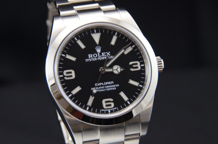 Detailed image of a stainless steel 39mm Rolex Explorer I 214270 with a stainless steel Rolex Oyster bracelet and a mark 2 dial with luminous numerals