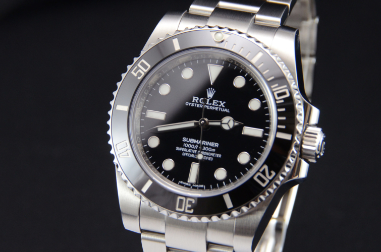 Detailed view image of a previously owned stainless steel Rolex Submariner No Date 114060 with a black dial and black ceramic bezel