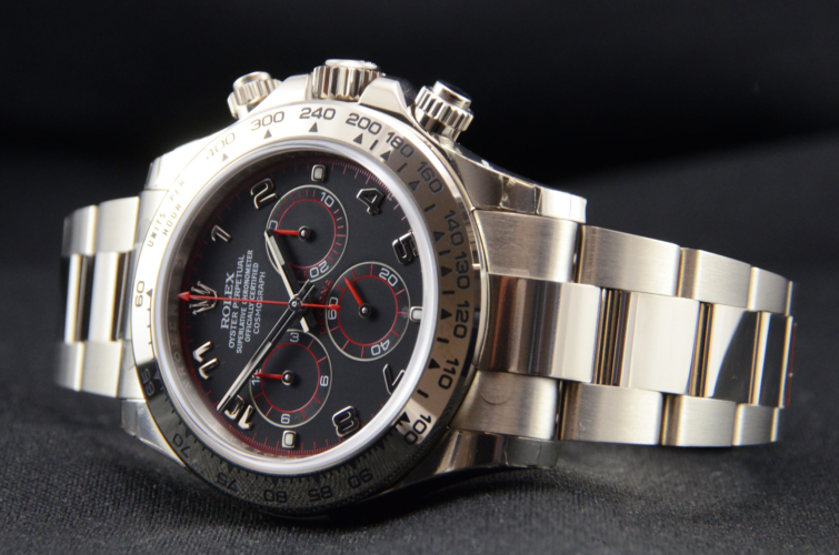 Detailed view image of a white gold 40mm Rolex Daytona 116509 featuring the desirable black & red racing dial