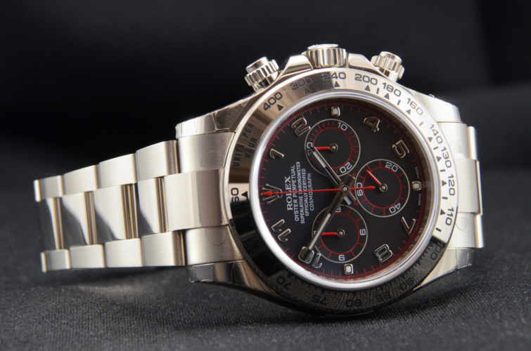 Detailed view image of a white gold 40mm Rolex Daytona 116509 featuring the desirable black & red racing dial