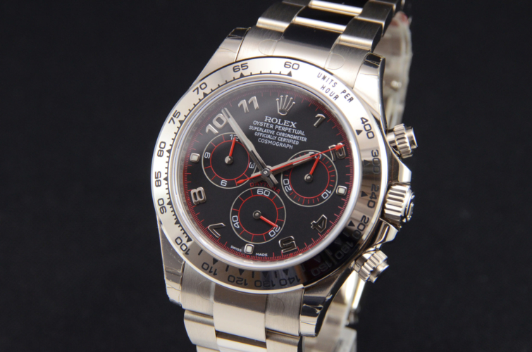 Detailed view image of a white gold 40mm Rolex Daytona 116509 featuring the desirable black & red racing dial