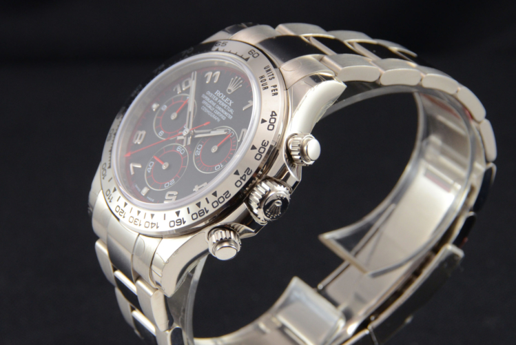 Detailed view image of a white gold 40mm Rolex Daytona 116509 featuring the desirable black & red racing dial