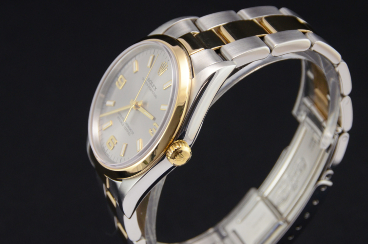 Detailed view image of a bimetal Rolex Oyster Perpetual 14203M in stainless steel & yellow gold, with a beautiful grey dial