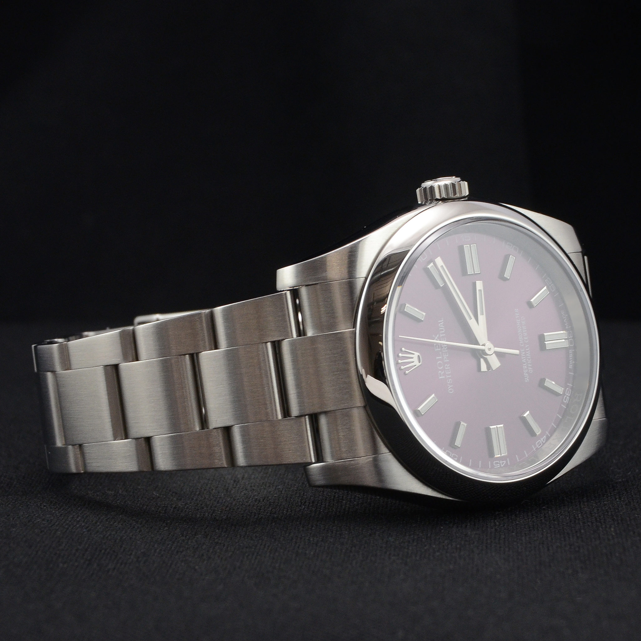 Second Hand Rolex Oyster Perpetual 116000 with a red grape (purple) dial Front view image of a used Rolex Oyster Perpetual 116000, 36mm case size, on a stainless steel Oyster bracelet with a starburst effect red grape dial