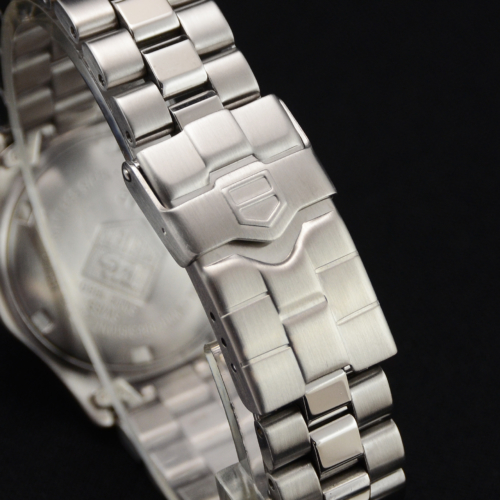 A detailed view image of a pre-owned TAG Heuer 2000 Professional Series WK1312 ladies' watch with a silver baton dial.