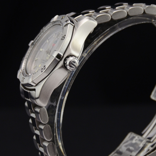 A detailed view image of a pre-owned TAG Heuer 2000 Professional Series WK1312 ladies' watch with a silver baton dial.