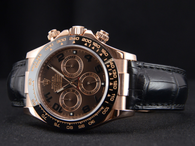 Detailed view image of a chocolate dial Rolex Daytona 116515LN with a black ceramic bezel and a black leather strap