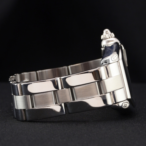 A detailed view image of a previously owned Cartier Roadster 2510 with a silver dial