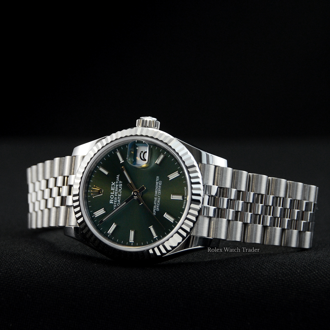 Overview of the watch resting on its case side Rolex Datejust 31 278274 Mint Green Dial Unworn 2021 For Sale Available Purchase Buy Online with Part Exchange or Direct Sale Manchester North West England UK Great Britain Buy Today Free Next Day Delivery Warranty Luxury Watch Watches