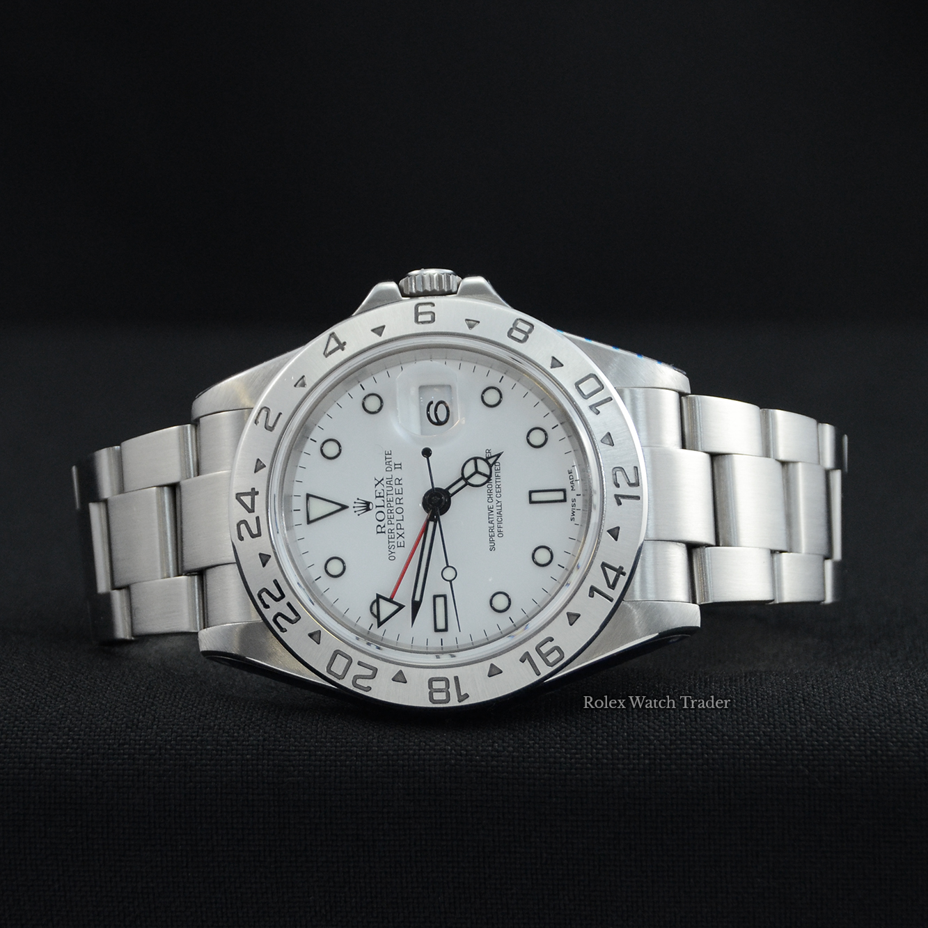Overview of the watch resting on its case side Rolex Explorer II 16570 40mm White Dial Serviced by Rolex Unworn Since For Sale Available Purchase Buy Online with Part Exchange or Direct Sale Manchester North West England UK Great Britain Buy Today Free Next Day Delivery Warranty Luxury Watch Watches